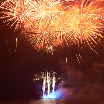 Red colorful fireworks on the black sky background