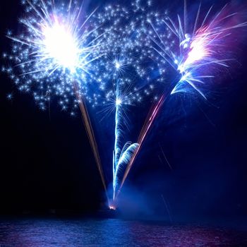 Colorful fireworks on the black sky background