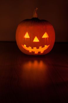 Funny halloween pumpkin glowing in the dark