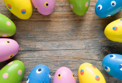 Painted easter eggs on a wooden background