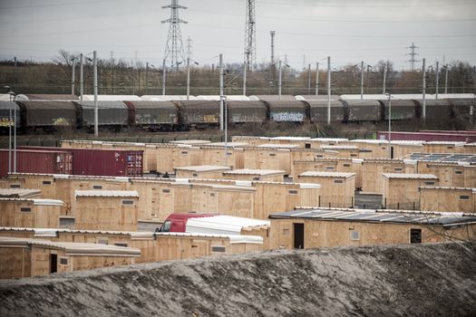 FRANCE, Grande-Synthe: Dozens of new wooden structures are pictured at the new camp at Grande Synthe on March 7, 2016.The new camp features make shift shelters to provide more protection from the elements. Also available are better sanitation measures including showers and toilets.  