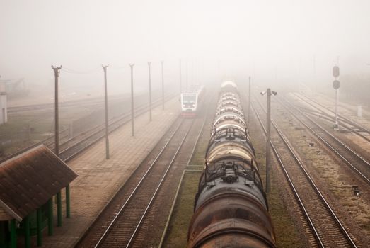 locomotive train in fog on station background