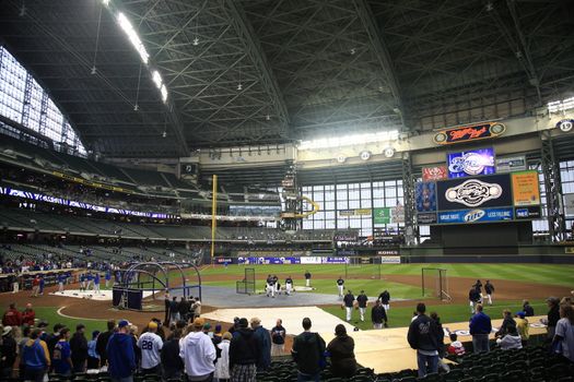 Brewers fans await a baseball game at Miller Park against the Chicago Cubs under a closed dome.