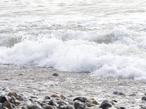 sea ocean wave boat stones France Normandy Manche