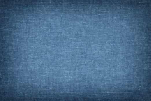 Blue knitted fabric texture closeup, useful as background