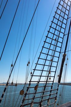 Marine rope ladder at pirate ship. Sea hemp ropes on the old nautical vessel.