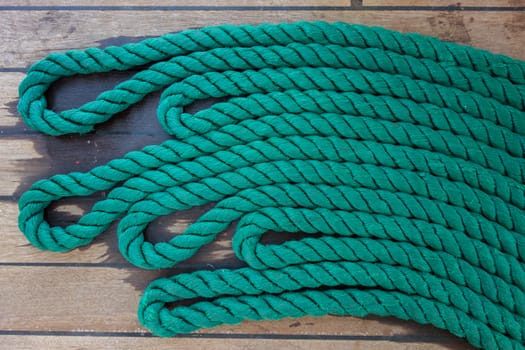 Thick rope on a wooden sailing ship floor
