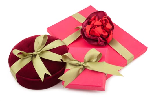 Luxury gift boxes with satin ribbon and bow isolated over white background.