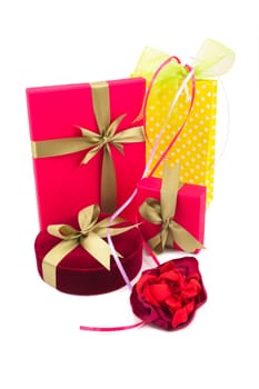 Luxury gift boxes with satin ribbon and bow isolated over white background.