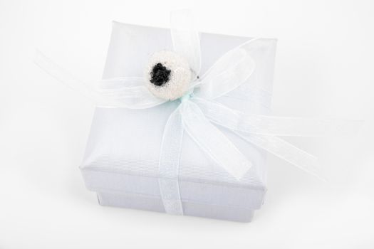 Simple gift box in light blue shades isolated over white background.