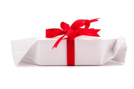 Luxury gift box with satin ribbon and bow isolated over white background.