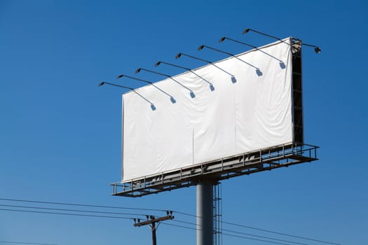 Blank billboard against blue sky, put your own text here