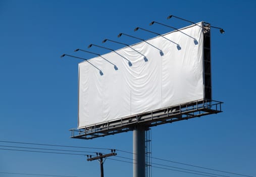 Blank billboard against blue sky, put your own text here