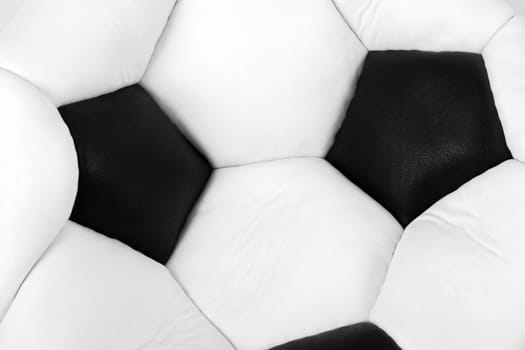 Deflated soccer ball isolated on white