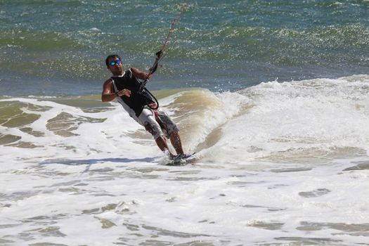 Kiteboarder enjoy surfing in ocean. Vietnam