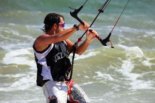 Kiteboarder enjoy surfing in ocean. Vietnam