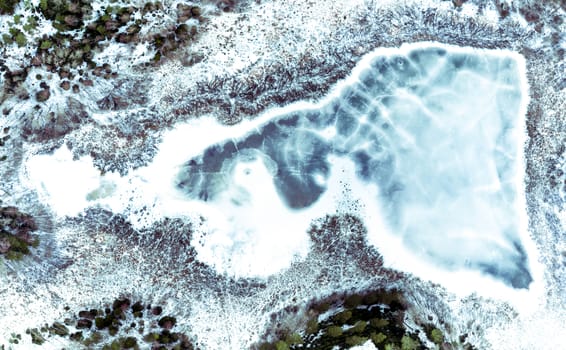 Frozen lake in late winter from above