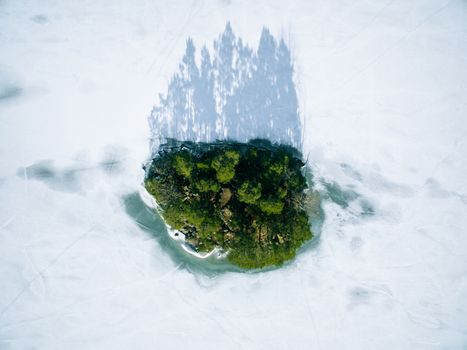 Small island with snow and ice in winter