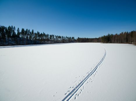 Cross country ski tracks on the frozen lake