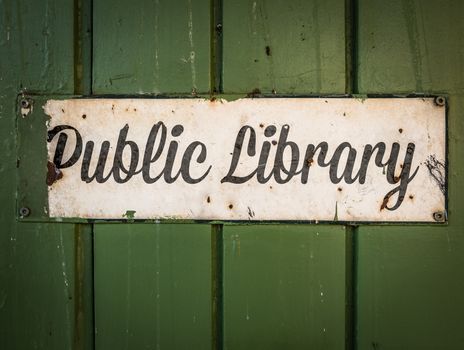 Rustic Retro Public Library Sign On A Green Wooden Background