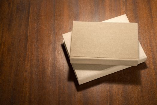 stack of  books  on the wooden scratched table