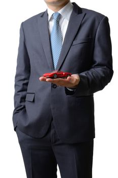 Businessman gives the model car to the customer isolated on white background, sale concept