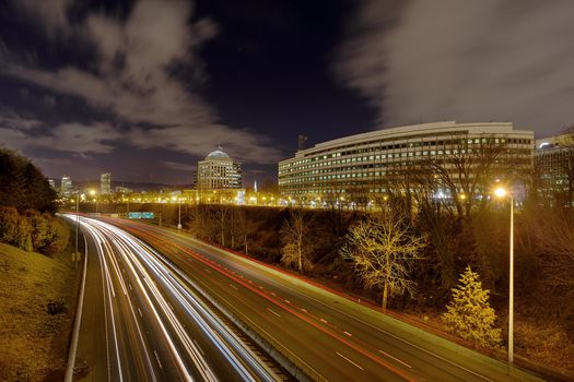 Portland Oregon Cityscape by Interstate Freeway I-84 at Night with traffic light trails