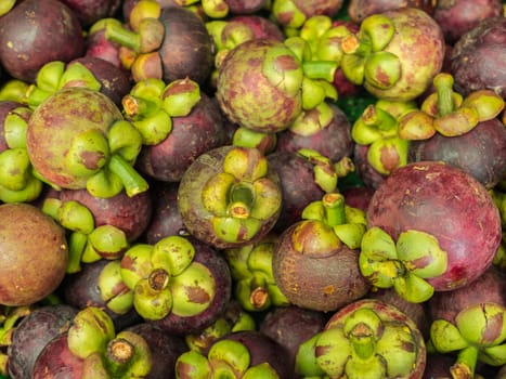 Closeup fresh mangosteen for sale at market.