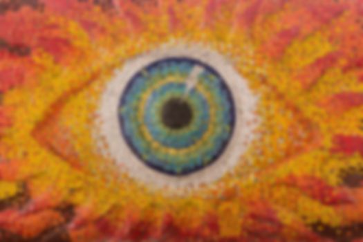 Colorful glass mosaic art shape eyes of god, blurred for backgrounds.