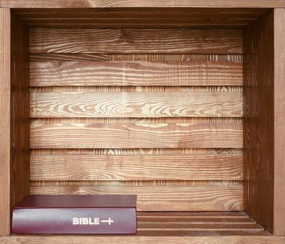 Bible book  in brown grunge old wooden shelf