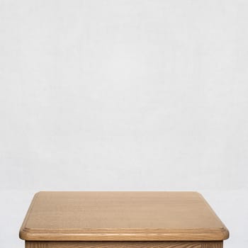  wooden table near the white wall at the bedroom