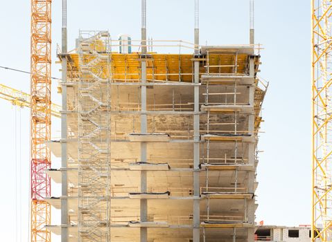 building and construction cranes, blue sky bqackground 