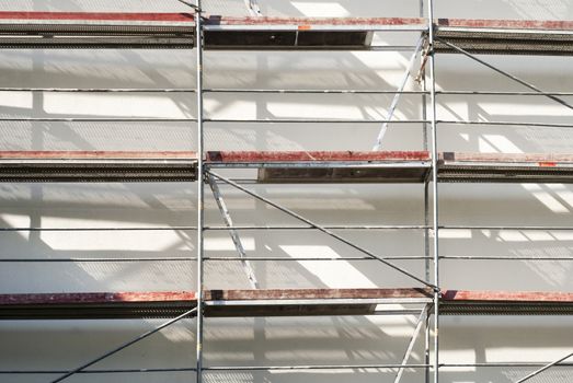 restoration facade of a house, scaffolding construction 