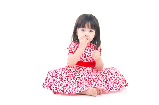 Beautiful asian girl sitting on the floor 