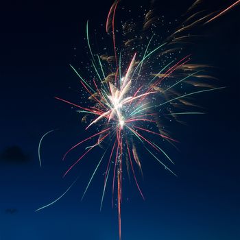 Blue colorful fireworks on night sky background