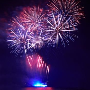 Blue colorful fireworks on the black sky background