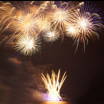 Red colorful fireworks on the black sky background