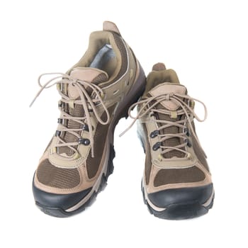 Pair of brown trainers on white isolated background