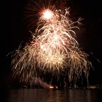 Red colorful fireworks on the black sky background