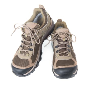 Pair of brown trainers on white isolated background