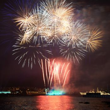 Red colorful fireworks on the black sky background