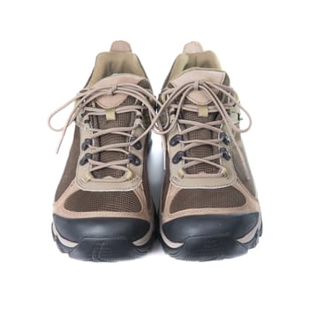 Pair of brown trainers on white isolated background