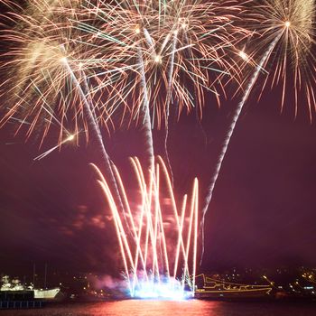 Red colorful fireworks on the black sky background