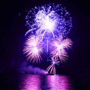 Blue colorful fireworks on the black sky background