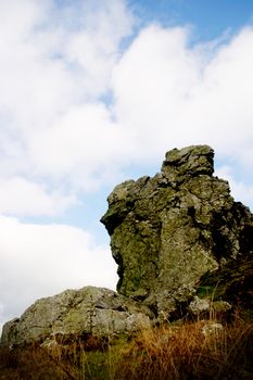 A rocky crag at the summit of a Welsh hillsdie