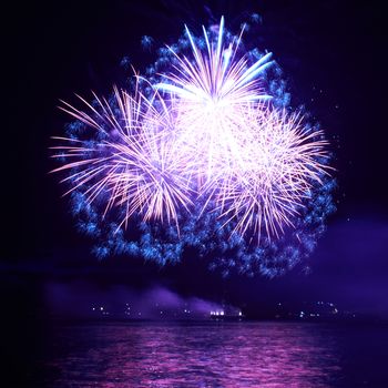 Blue colorful fireworks on the black sky background