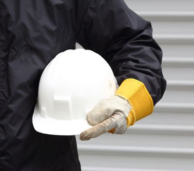 Man holding white helmet close up