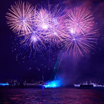 Blue colorful fireworks on the black sky background