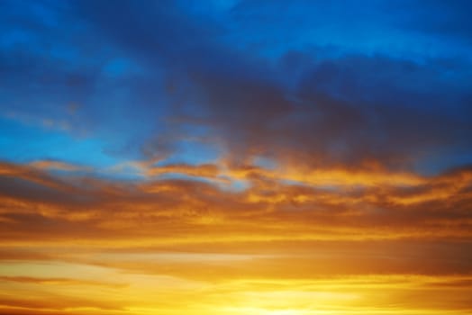 Dramatic sky at sunset with red, yellow, orange and blue colors