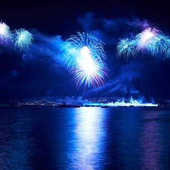 Blue colorful fireworks on the black sky background